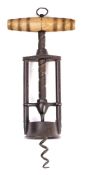A 19th Century iron patent corkscrew: the central helix between two plain columns with ring turned