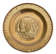 A 16th/early 17th Century Nuremburg brass alms dish: with embossed decoration of 'The Spies'