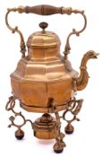 A rare and important early 18th Century brass tea kettle on stand with spirit burner: of octagonal