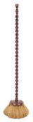 A rare early 18th Century maid's broom: with circular head and walnut barley-twist turned handle,