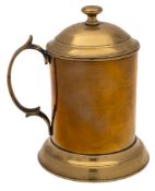A George III period brass lidded tankard: of plain cylindrical outline with domed lift-off lid and