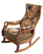 A Victorian mahogany 'Goose Neck' rocking armchair:, the curved back,