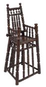 An early to mid 17th Century child's turned ash and oak high chair: the tapered back with urn