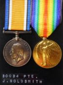A Great War pair to 30034. Pte. J. Goldsmith. G.Gds: includes War and Victory medals.