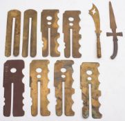 A group of various brass button sticks and two trench art letter openers:.