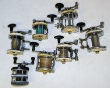 A group of six Mitchell 600 series salt water reels: and an Ambassador 'Mag III' reel.