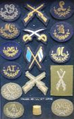 A collection of Guards trade and skill-at-arms cloth badges: including, Signaller, Gun Layer,