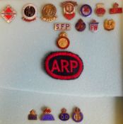 A small group of World War II Fire Watchers and Civil Defence lapel badges: includes cloth badge.