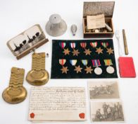 A collection of various militaria:, including WWII service medals, buttons,