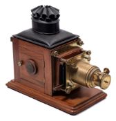 A late 19th century mahogany and brass 'Optimus' magic lantern by Perkinson & Rayment, London:,