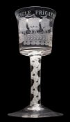 An opaque twist wine glass: the bucket shaped bowl engraved with a three masted vessel below the