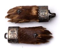 An early 20th century silver plate mounted otter's pad belt buckle:,