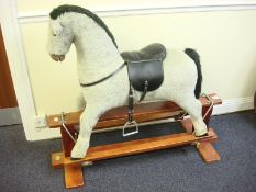 A plush grey rocking horse by 'Thoroughbred Horses': with black plush mane and tail,