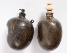 Two Islamic bronze powder flasks: of globular kidney shaped form , one with ivory stopper,