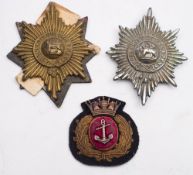 Two Worcestershire Regimental pouch badges and Merchant Marine cloth badge:.