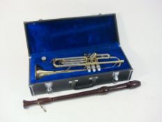 A lacquered brass trumpet by Danor:, in a fitted case,