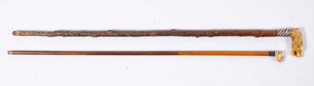 A late 19th century carved ivory dog's head walking cane:,