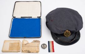 A WWII RAF blue cloth peaked cap:, size 7, dated 1944, together with two WWI medals,