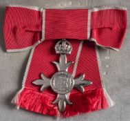 A Civil MBE awarded to Margaret Woodland (1915-2003) for services to child health:,