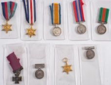 A group of nine miniatures:, including a Victoria Cross, two Queen's South Africa Medals and others.