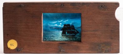 A 19th century hand painted magic lantern slipping slide of a sailing ship on a moonlit sea:,