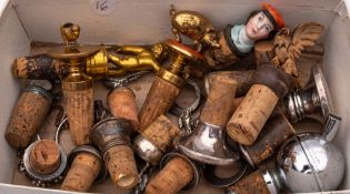 A collection of various humorous silver plate mounted and other stoppers:,