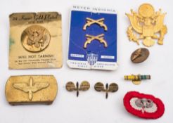 A group of American military insignia, badges and patches etc:..