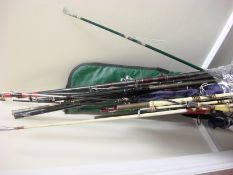 A collection of mid to late 20th century fishing rods,: both fresh and saltwater rods,