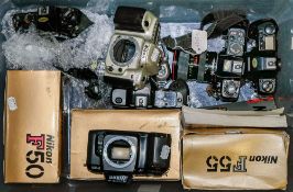 A collection of various Nikon 35mm camera bodies and accessories:, including F-50,