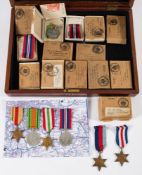 A collection of WWII service medals with postage boxes: also several empty postage boxes (a lot)