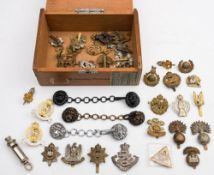 A collection of various cap badges:, including 'Tank Corps', '22nd Dragoons',