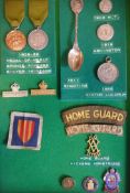 A collection of assorted military medals, cloth badges etc:,