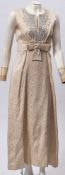 A mid -20th century white silk and embroidered evening dress by Blanes:, size 14,