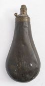 A copper and brass powder flask:, unsigned, 19cm long.