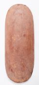 An oval carved and painted shield, 64cm long.