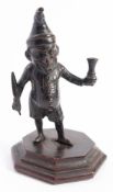 A late 19th /early 20th century bronze Mr Punch clubroom table lighter:,