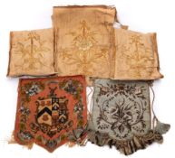 A group of late 19th century textiles: comprising a bead work armorial face screen,