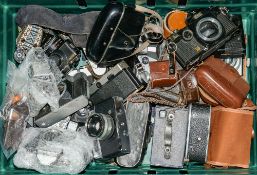A collection of various cameras including a Box Brownie:,