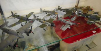 A collection of 1:48 and 1:32 scale model aircraft:, including P45 Mustangs and P47 Thunderbolts.