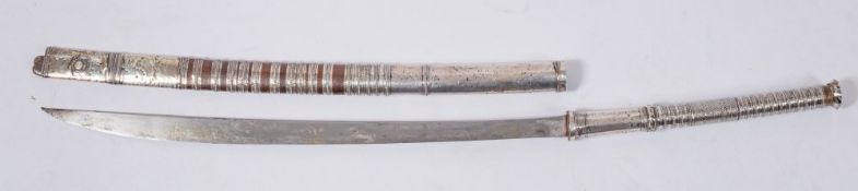 A late 19th century silver mounted Burmese dha:,