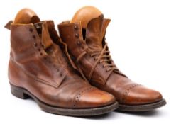 A pair of vintage men's brown leather ankle boots:, unsigned, with brogue decorated toecap,