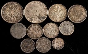A German 1913 2 mark:, a 1914 and 1916 half mark, a 1914 mark,