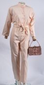 A 1970s Biba salmon pink cotton jumpsuit with belt: size 'M' with nehru collar and pink plastic
