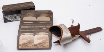 A Holmes pattern stereoscopic viewer and a quantity of stereoscope cards by Underwood & Underwood:.