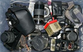 A collection of various Canon 35mm camera bodies and accessories:, including T50, EOS 1000F,