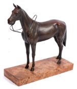 A 20th century bronze figure of a racehorse:, unsigned on a marble base, 26cm high.
