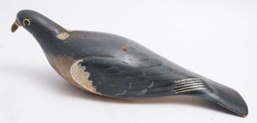 A painted wooden pigeon decoy:, 34cm long.