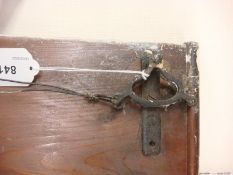 A late 19th century servant's call bell set of six bells: mounted on a pine panel, 22 x 191cm..