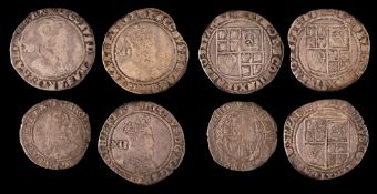 A Charles I sixpence and three James I shillings.