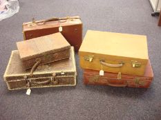 A crocodile skin suitcase: together with a smaller crocodile skin vanity case and three other